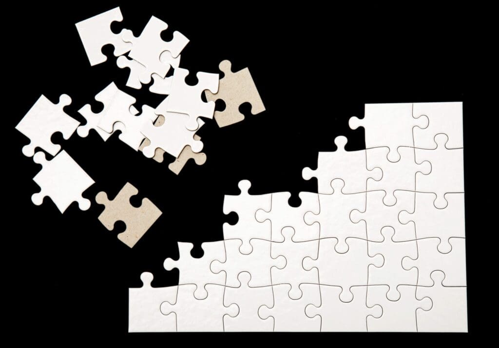White puzzle on a black background
