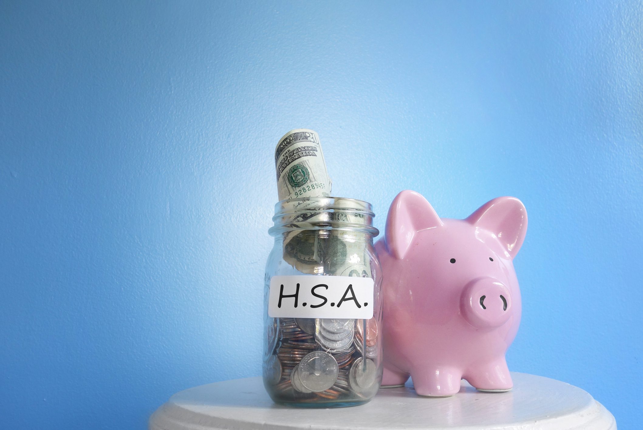 Health Savings Account ( HSA ) coin jar with piggy bank