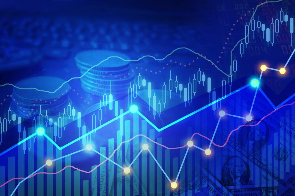 Business financial concept with double exposure stock market up trading line graph and line chart with coins background.