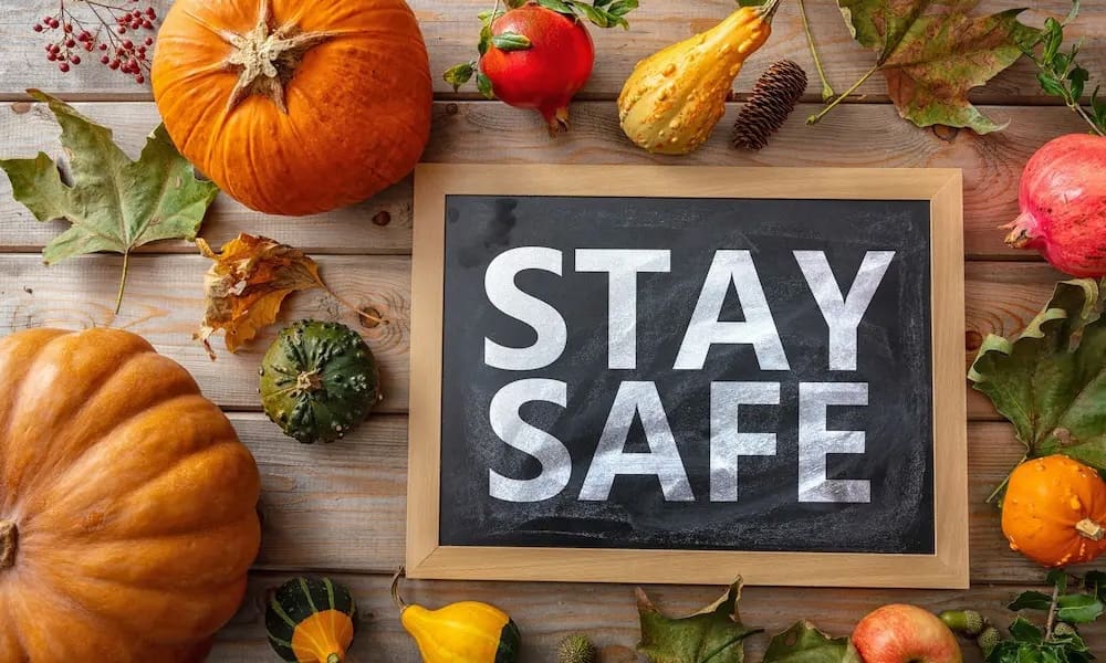 Thanksgiving-Safety-Tips-for-Homeowners-tablescape-of-pumpkins-and-stay-safe-sign