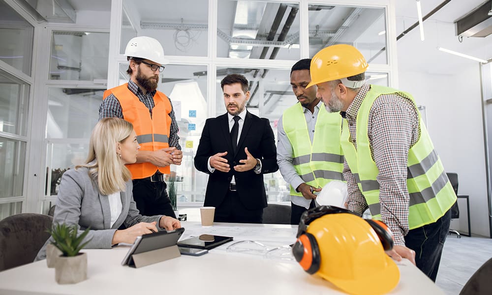 Blog - Contractors and Business People Talking in an Office at a Conference Table