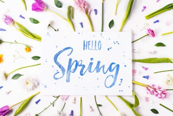 Easter and spring flat lay on a white wooden background.